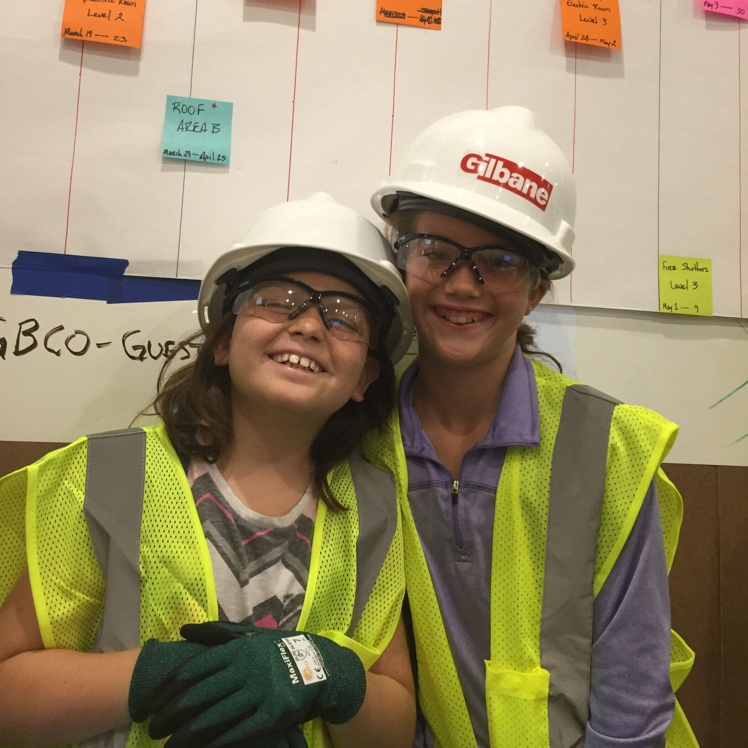 two kids wearing hard hats